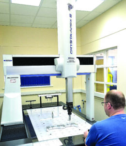 Martin-Baker positioning CMM head to prepare for inspection