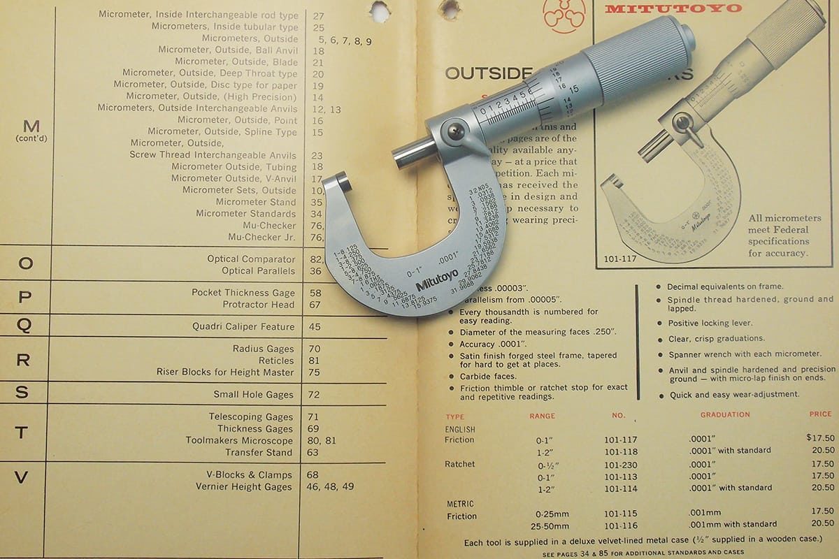 Mitutoyo Micrometer sitting on top of an old Mitutoyo catalog